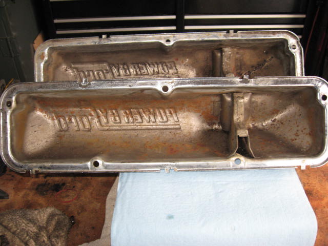 Two used chrome valve covers with "POWER-FLO" embossed on them