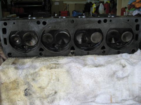 1963 Ford Galaxie - A close-up view of an engine cylinder head, showing the intake and exhaust valves for four cylinders.