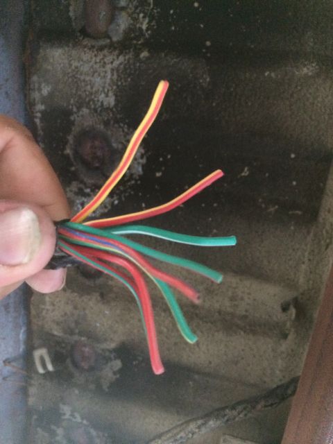 1987 Suzuki Samurai - A close-up view of a collection of multi-colored electrical wires, some of which appear to be stripped.