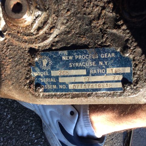 1979 Ford Bronco - Identification plate from a New Process Gear component, showing model and assembly numbers.