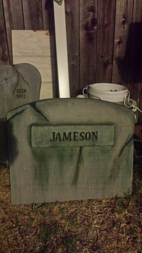 1989 Ford Bronco - A fake tombstone decoration with the name JAMESON is displayed outdoors.