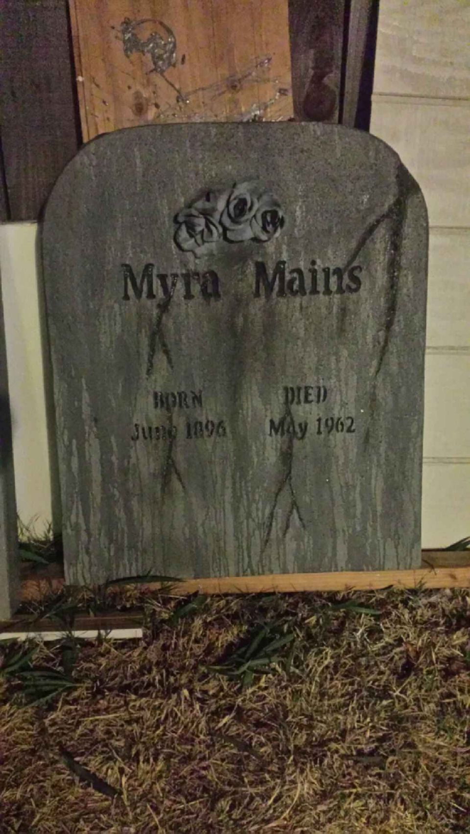 Gravestone with roses and text 'Myra Mains', 'BORN June 1896', 'DIED May 1962'