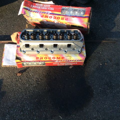 1979 Ford Bronco - Pair of Procomp high performance alloy heads, one installed on its box.