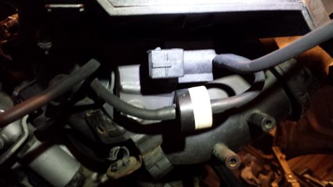 2002 BMW 3 Series - Engine part with hoses and an electrical connector visible.