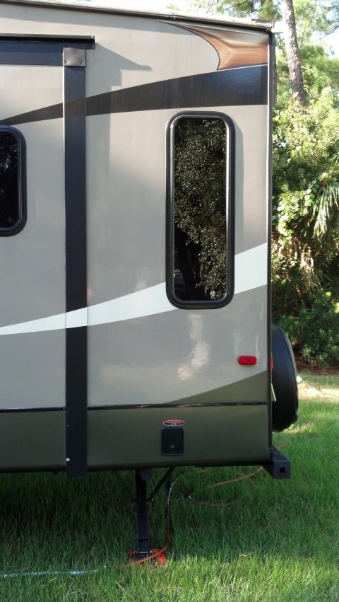 1995 Ford Bronco - This travel trailer has a two-tone paint scheme and a spare tire on the rear.