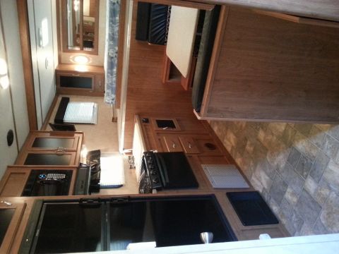 1967 Ford Mustang - Interior of a recreational vehicle showing the kitchen and living space.