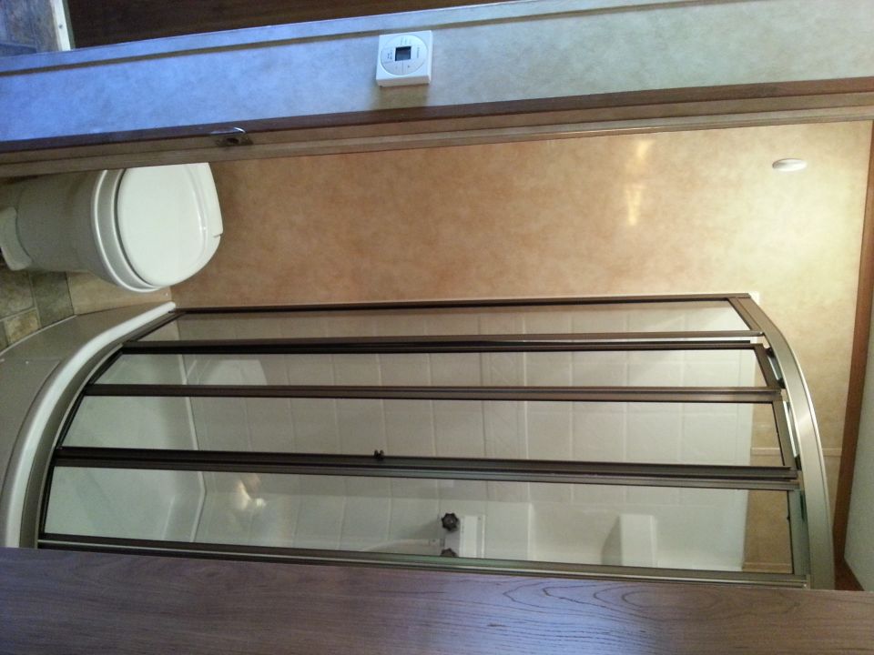 RV bathroom interior with toilet and shower stall