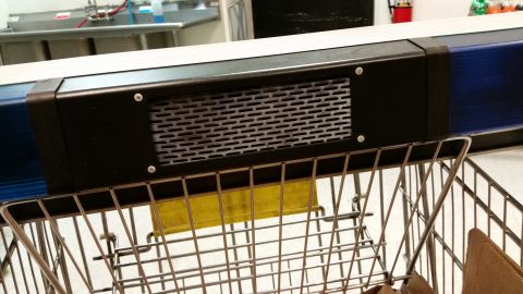2001 Ford Crown Victoria - Close-up of a light bar component with a metal grille, positioned above a shopping cart.