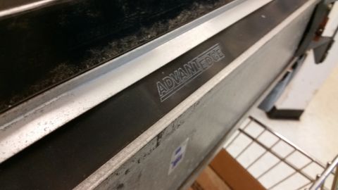 2001 Ford Crown Victoria - The 'ADVANTEDGE' logo is visible on a metallic component, suggesting it is a manufactured part.