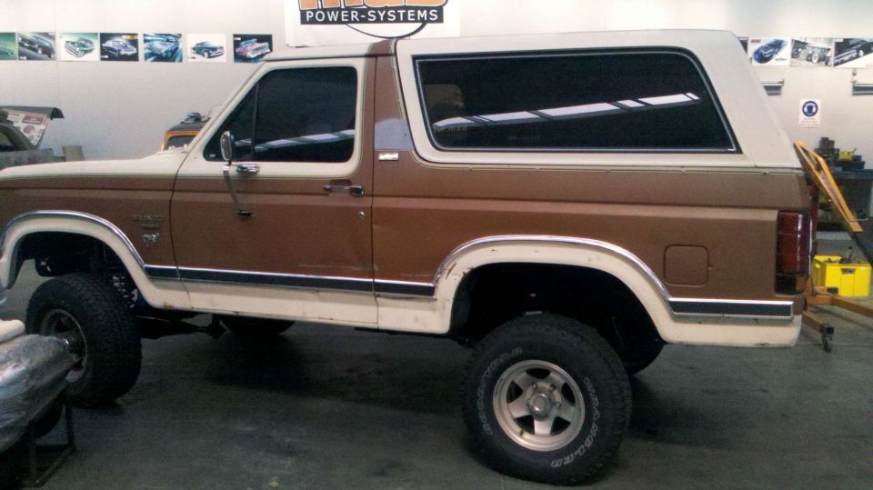 1982 Ford Bronco, brown and white, lifted suspension, side view