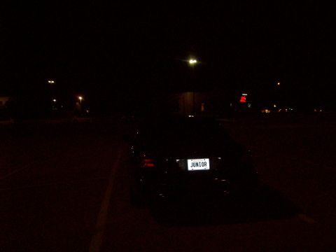 2004 Ford Crown Victoria - Car parked at night with a license plate that says JUNIOR.
