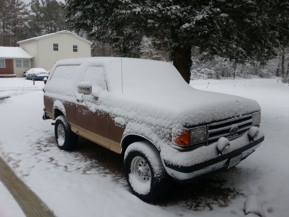1991 Ford Bronco in snow, 3q-front view, brown and tan