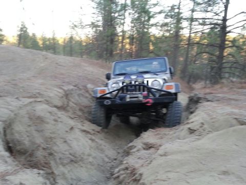 2005 Jeep Wrangler - Jeep Wrangler navigating a challenging off-road trail.