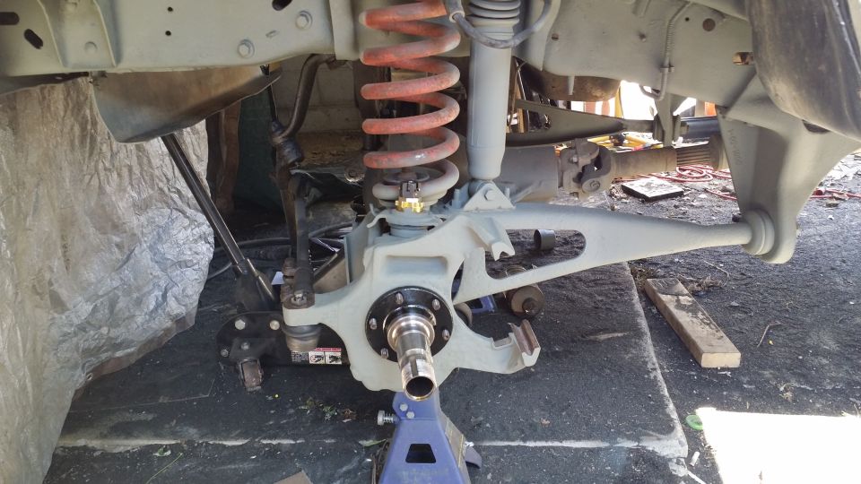 Front suspension and hub assembly with orange coil spring