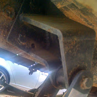 1979 Ford F-150 - Detail of a truck's undercarriage, focusing on a frame-mounted bracket.