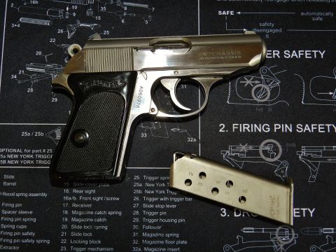 1996 Ford Bronco - A Walther PPK pistol and its magazine are displayed on a mat gun schematics and safety instructions.