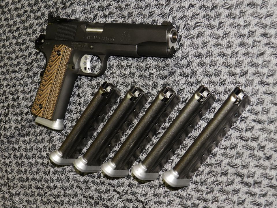 Springfield RO 1911 pistol with extended base plates on five magazines