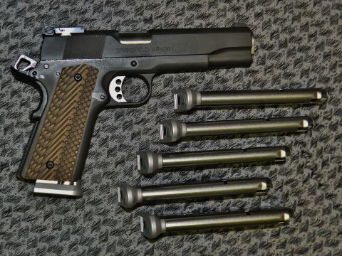 1996 Ford Bronco - A Springfield Armory pistol is shown with several interchangeable barrels, suggesting customization options.