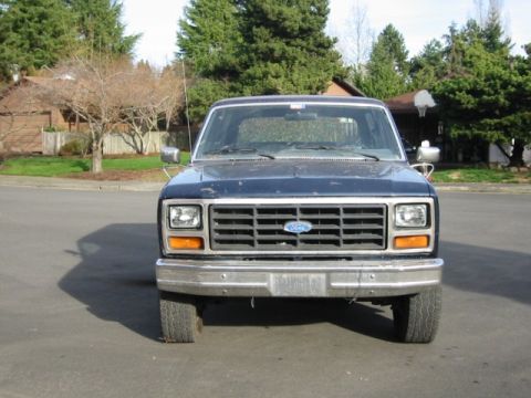 1985 Ford Bronco - This 1980s Ford Bronco shows its front end, a prominent grille and bumper.