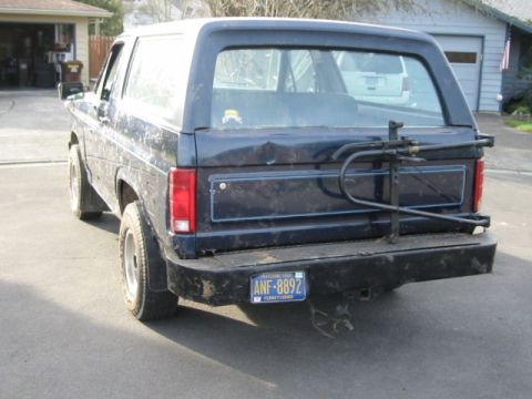 1985 Ford Bronco - This SUV's body style suggests an earlier model year than claimed, with a visible bike rack and license plate.