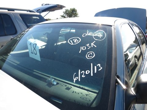 2001 Ford Crown Victoria - Markings on the windshield include a lot number '18', mileage '103K', and a date '6/20/13'.