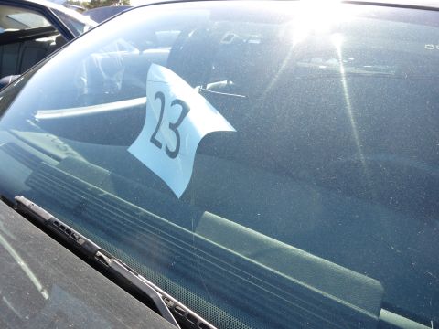 2001 Ford Crown Victoria - A blue auction number is taped to the windshield of a vehicle, obscuring the interior details.