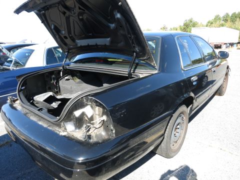 2001 Ford Crown Victoria - This 2001 Ford Crown Victoria is seen from the rear with its trunk open, revealing damage to the taillight assembly.