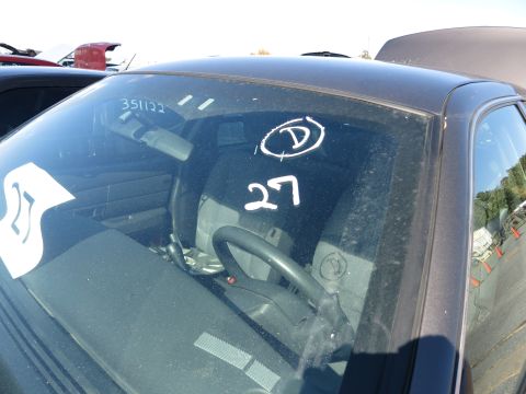 2001 Ford Crown Victoria - White markings 'D' and '27' are visible on the windshield of this sedan's interior.