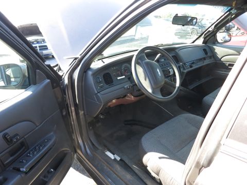 2001 Ford Crown Victoria - Interior of a 2001 Ford Crown Victoria, showing the driver's side dashboard and front seat.