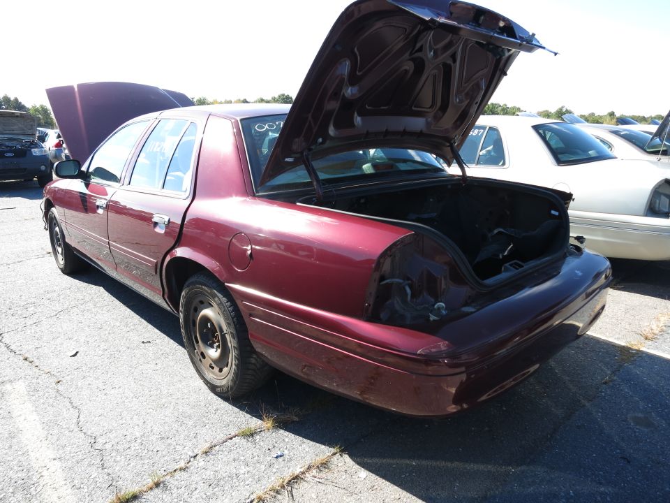 Maroon 2001 Ford Crown Victoria rear view with trunk and hood open