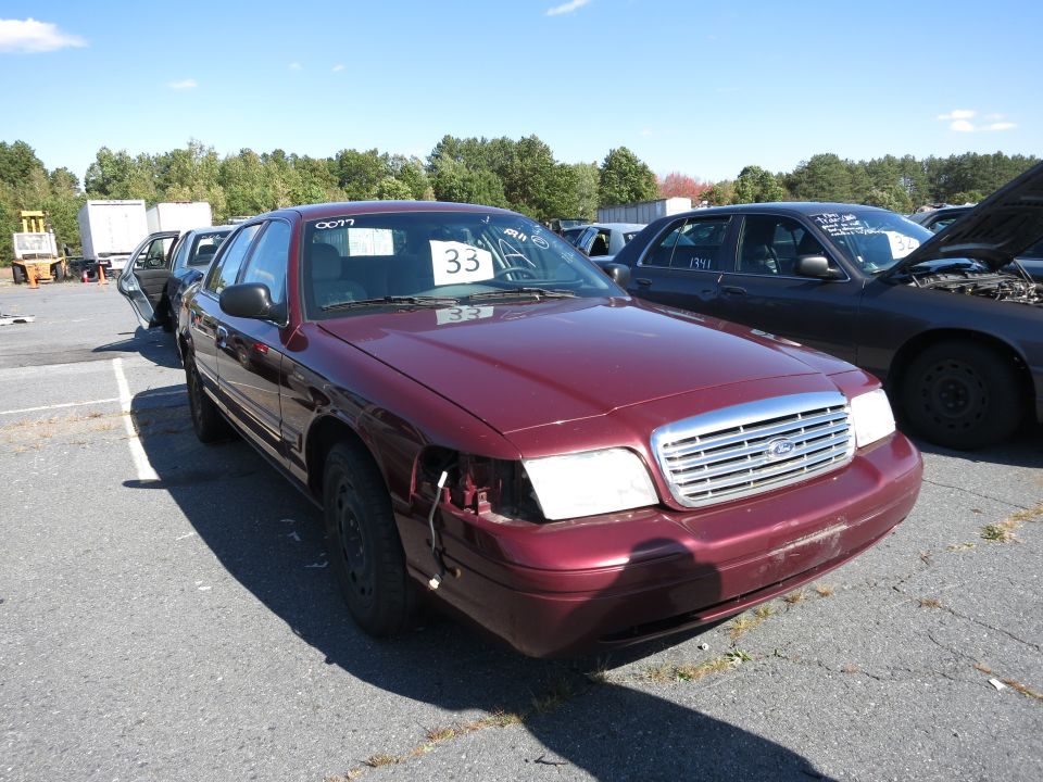 Maroon sedan, 3q-front view. 2001 Ford Crown Victoria