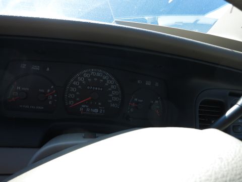 2001 Ford Crown Victoria - Interior view of a car's dashboard, displaying the speedometer and other gauges.