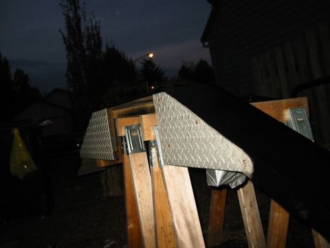 1985 Ford Bronco - Homemade ramp or stand made of wood and diamond plate metal.