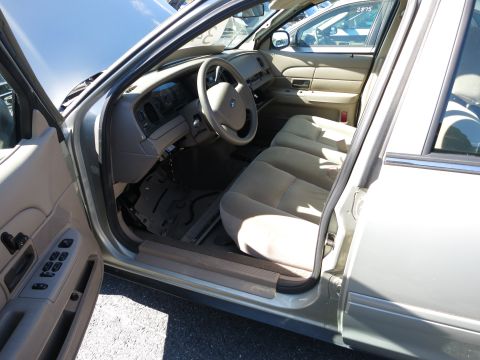 2001 Ford Crown Victoria - The interior of a 2001 Ford Crown Victoria is seen from the driver's side with the door open.