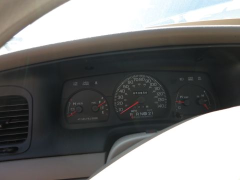 2001 Ford Crown Victoria - The interior dashboard of a 2001 Ford Crown Victoria displays the odometer reading 73,858 miles.