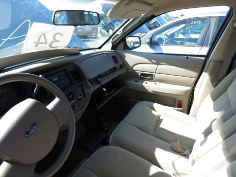 2001 Ford Crown Victoria - Interior of a 2001 Ford Crown Victoria, with other vehicles seen through the windows.
