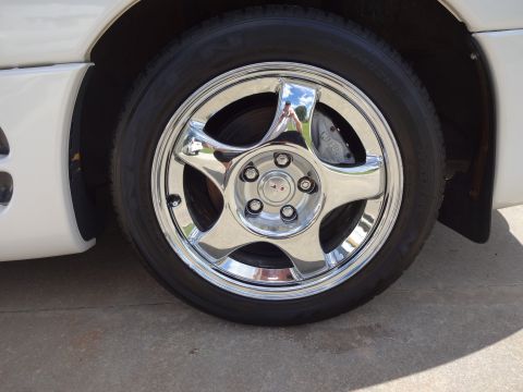 1995 Mitsubishi 3000GT - Close-up of a chrome wheel and tire, with a visible 'MITSUBISHI' brake caliper.