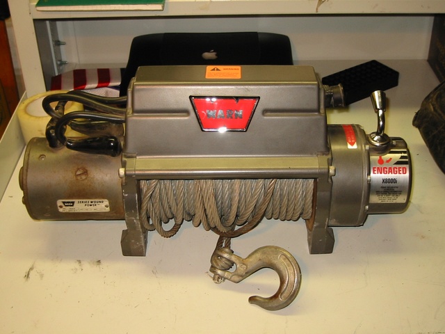 Warn X3000 winch with steel cable and hook, mounted on a surface