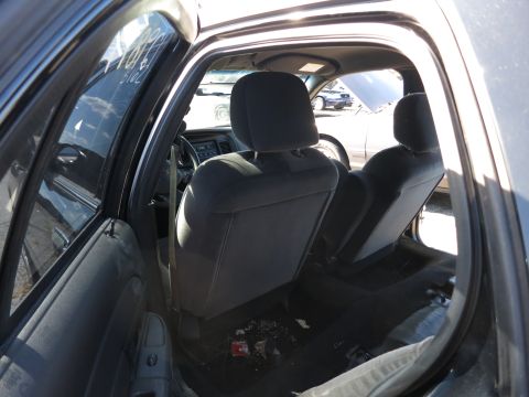 2001 Ford Crown Victoria - The interior of a 2001 Ford Crown Victoria is visible, with a second vehicle in the background.