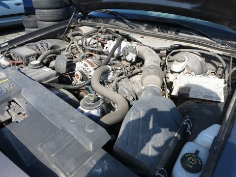 2001 Ford Crown Victoria - Engine bay of a 2001 Ford Crown Victoria, showing the V8 engine and associated components.