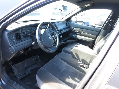 2001 Ford Crown Victoria - Interior view of a 2001 Ford Crown Victoria, showing the dashboard and front seats.