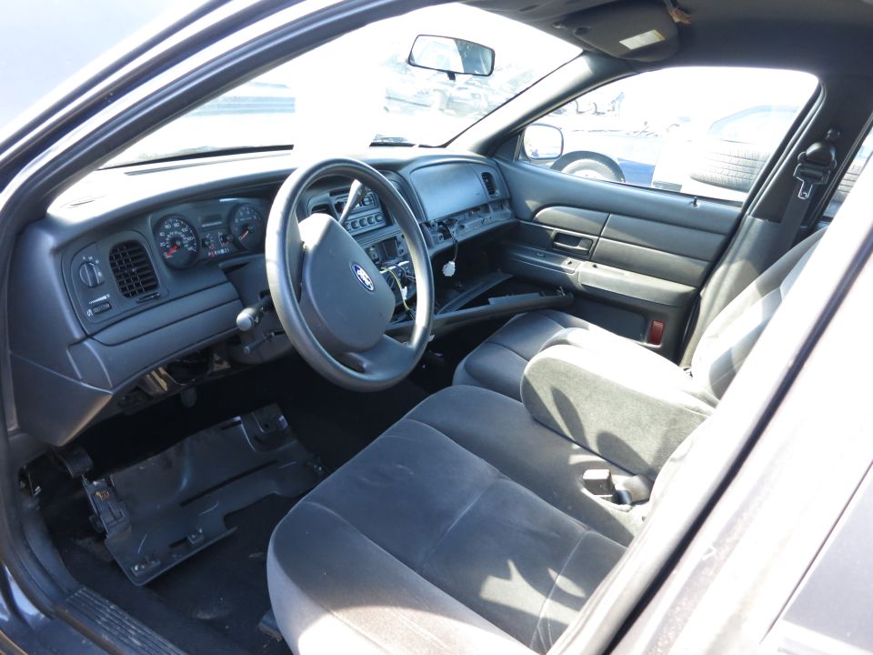 2001 Ford Crown Victoria interior showing dashboard, steering wheel, and seats