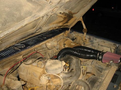 1985 Ford Bronco - Engine bay of a 1985 Ford Bronco with an aftermarket air intake system installed.
