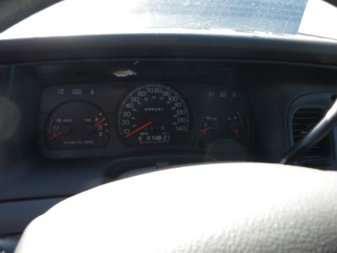 2001 Ford Crown Victoria - Dashboard view of a 2001 Ford Crown Victoria, showing the instrument cluster and steering wheel.