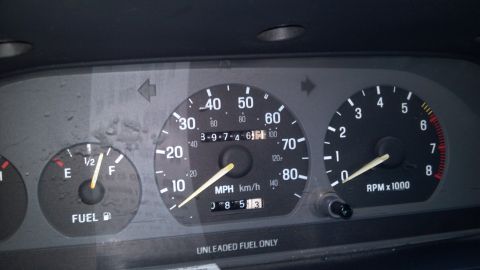 1993 Mercury Tracer - Dashboard gauges show fuel level, speed, and RPMs, with the speedometer indicating 30 MPH.