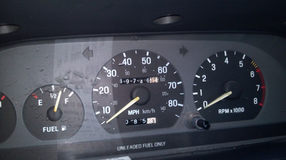 Dashboard gauges with fuel, speedometer, and tachometer. Speedometer reads 30 MPH