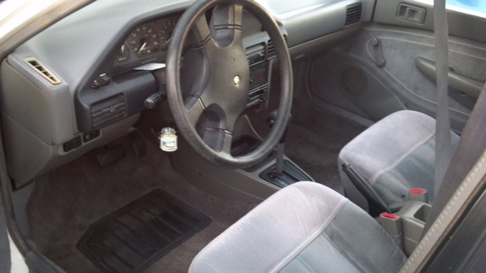 1993 Mercury Tracer interior with dashboard, steering wheel, and seats