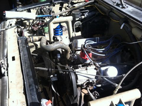 1995 Ford Bronco - Close-up view of a vehicle's engine bay, showing the V8 engine and associated components.