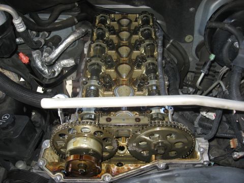 1994 Ford Bronco - Close-up view of an engine's internal valve train components, including camshafts and timing chain.
