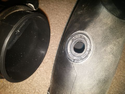 2000 Mercury Grand Marquis - Close-up of a black air intake hose, showing a circular connection point.